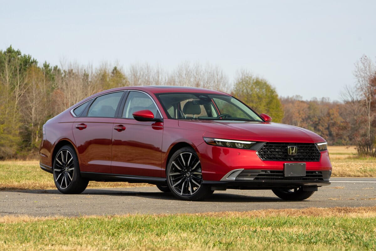 The red Honda Accord against a rural backdrop is one of the safest mid-range models.