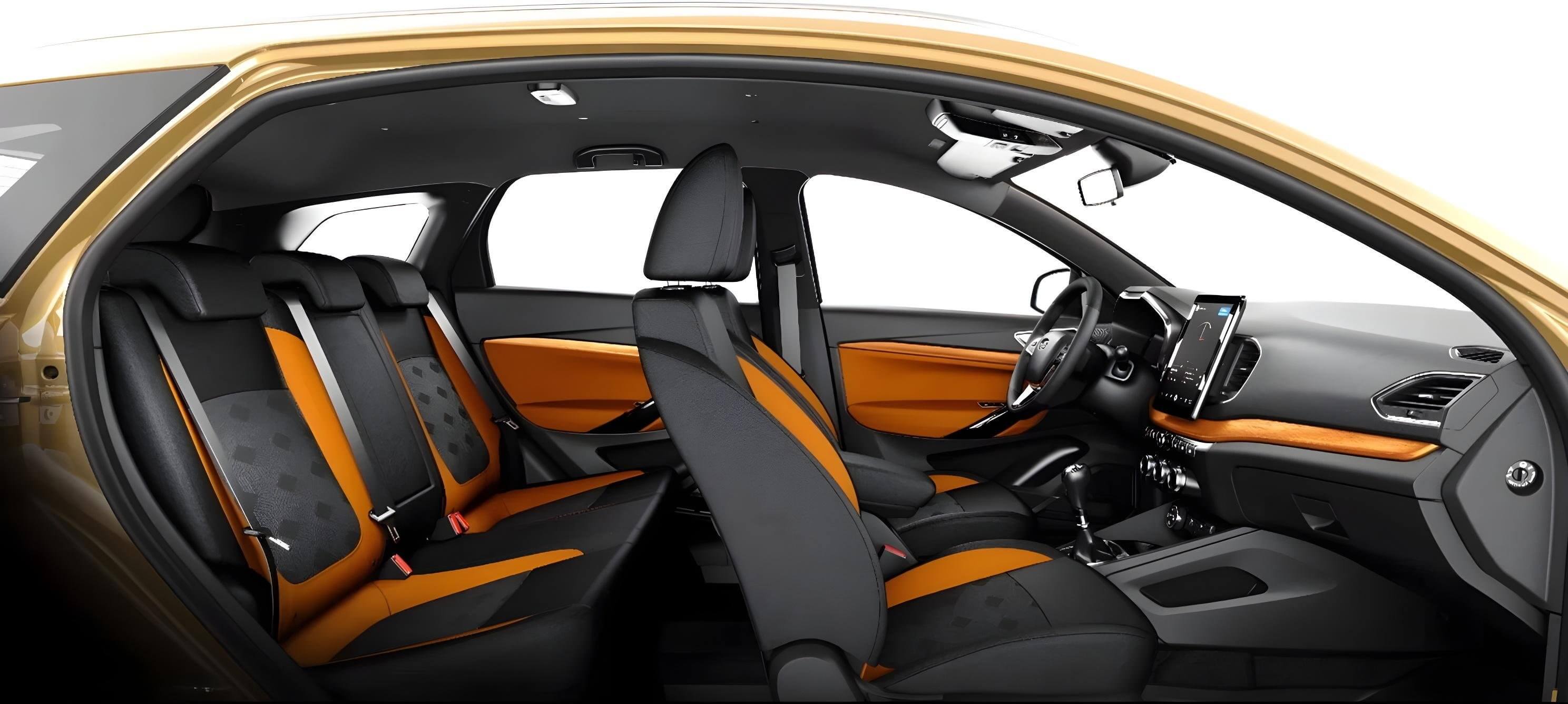 Салон LADA Vesta NG 2025 с оранжевыми акцентами и цифровым экраном.